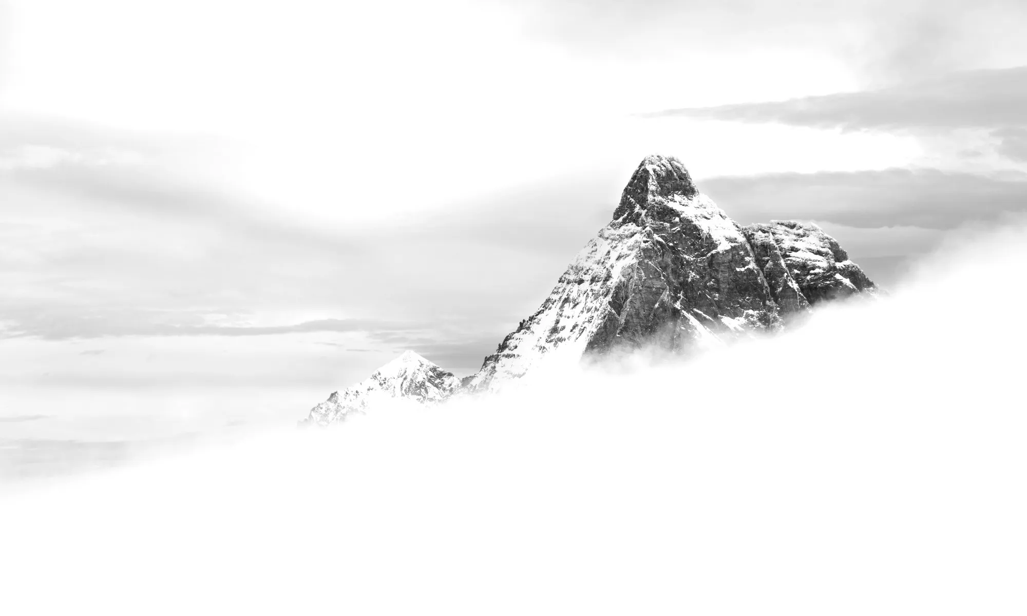A summit emerging from a sea of clouds